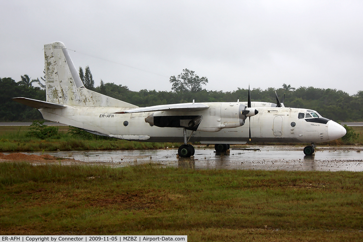 ER-AFH, 1976 Antonov An-26B C/N 3901, The weather was as bad as the state of this aircraft. According to my guide in Belize this plane was used in a drugs-related flight, abandoned by the drugsdealers and since then parked next to the runway for display.