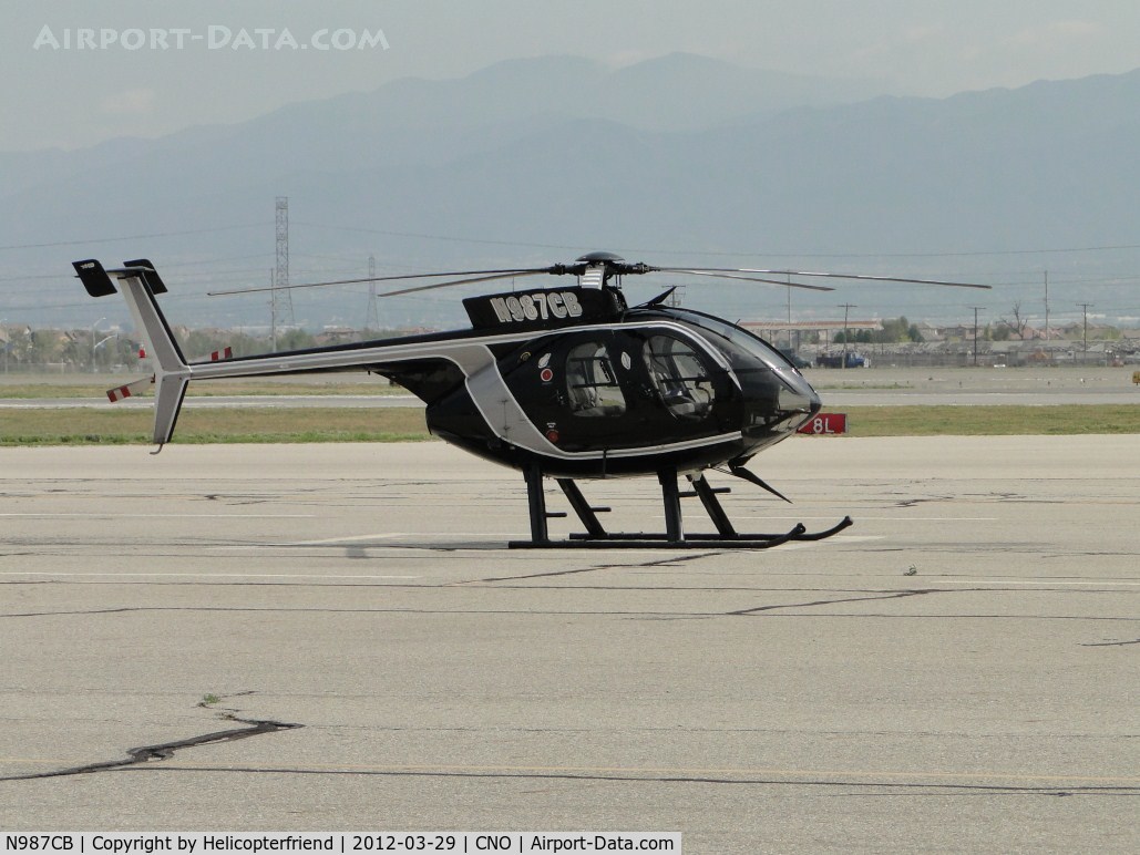 N987CB, 1999 McDonnell Douglas 500-E C/N 0543E, Parked on a pad southeast of the tower