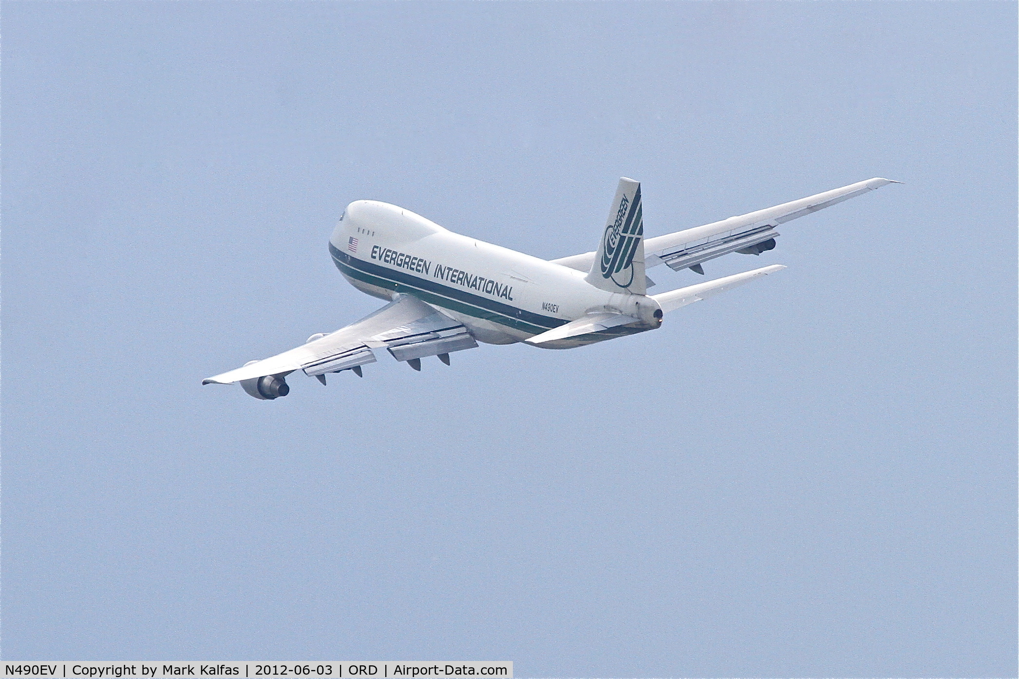 N490EV, 1988 Boeing 747-230F C/N 24138, Evergreen International Airlines Flight #876 arriving from Anchorage, is on the missed approach RWY 28 at Chicago's O'Hare..An American Airlines 738 (N989AN) had touched down less than a minute prior to Evergreen's arrival and did not clear the runway.