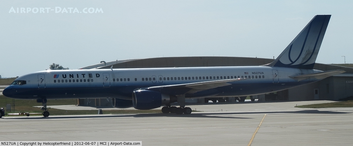 N527UA, 1991 Boeing 757-222F C/N 24995, Being towed to the south end of the airport, past Fire Station