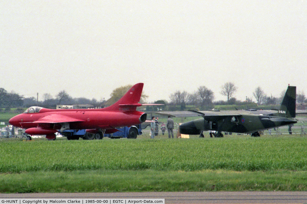 G-HUNT, 1956 Hawker Hunter F.51 C/N 41H-680277, Hawker Hunter F51 with G-DLRA Britten-Norman BN-2 Astor at Cranfield in 1985.