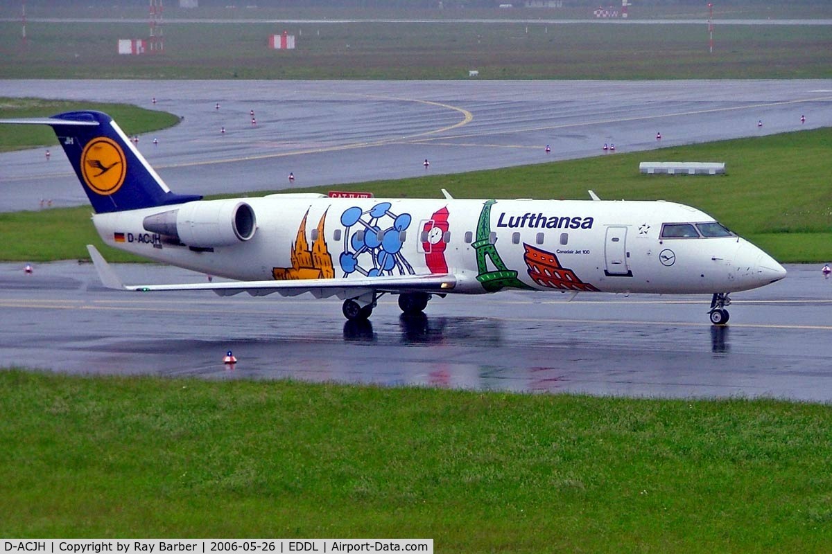 D-ACJH, 1998 Canadair CRJ-200LR (CL-600-2B19) C/N 7266, Canadair CRJ-100LR [7499] (Lufthansa Regional)  Dusseldorf~D 26/05/2006. Taxiing in the rain for departure.