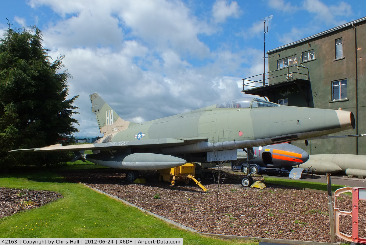 42163, North American F-100D Super Sabre C/N 223-43, Former French Air Force F-100D now painted in USAF markings as 54-2163 and dedicated to the US Air National Guard and is depicted as one flown by Capt. John M. Haley, 174th TFS, Iowa Air National Guard, during the squadron’s tour in Vietnam.
