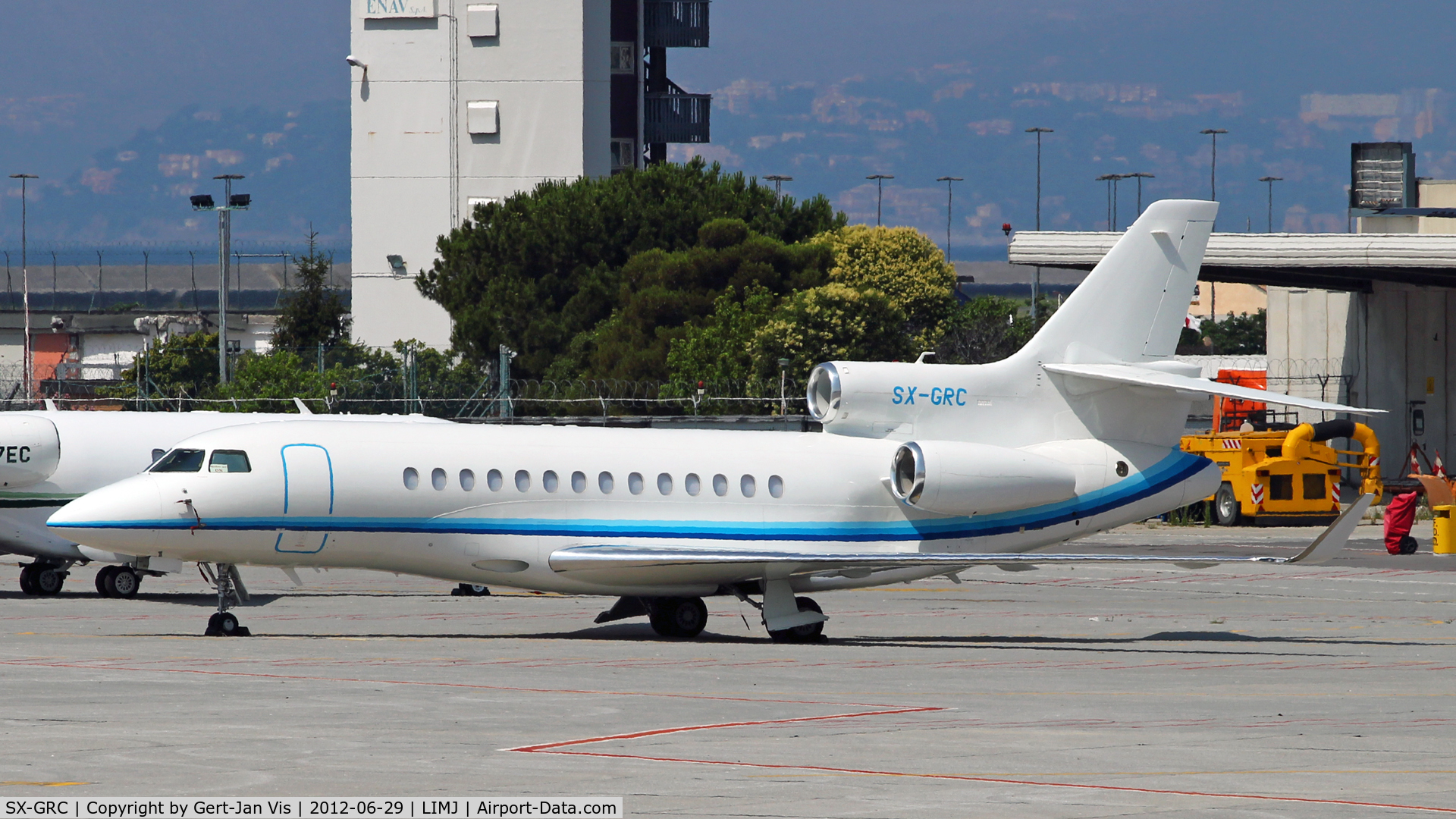 SX-GRC, 2010 Dassault Falcon 7X C/N 109, Taken from the road to the departurehall, facing some heatwaves.