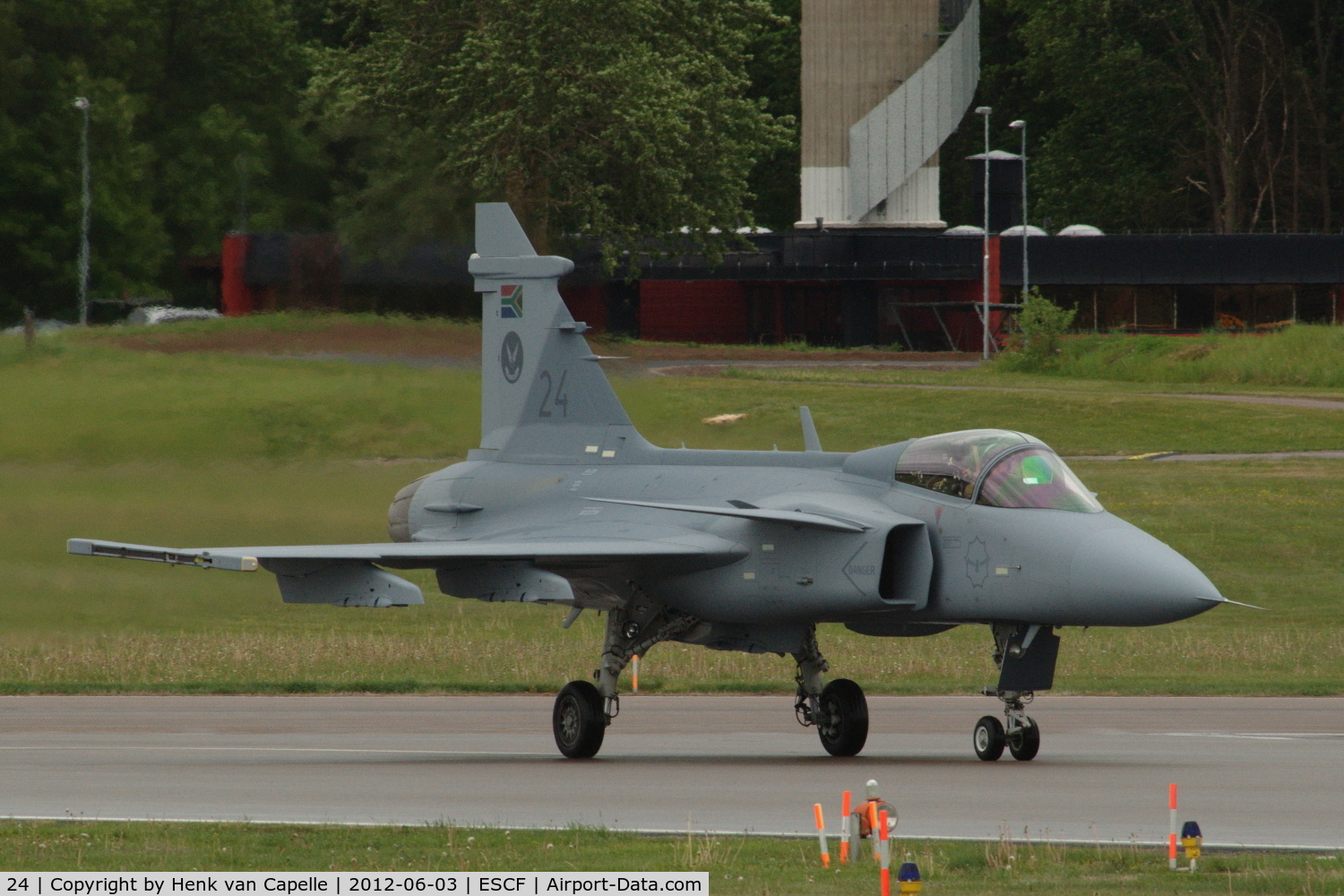 24, Saab JAS-39C Gripen C/N 392115, Saab Gripen of the South African Air Force taxying at Malmen Air Base, Sweden.