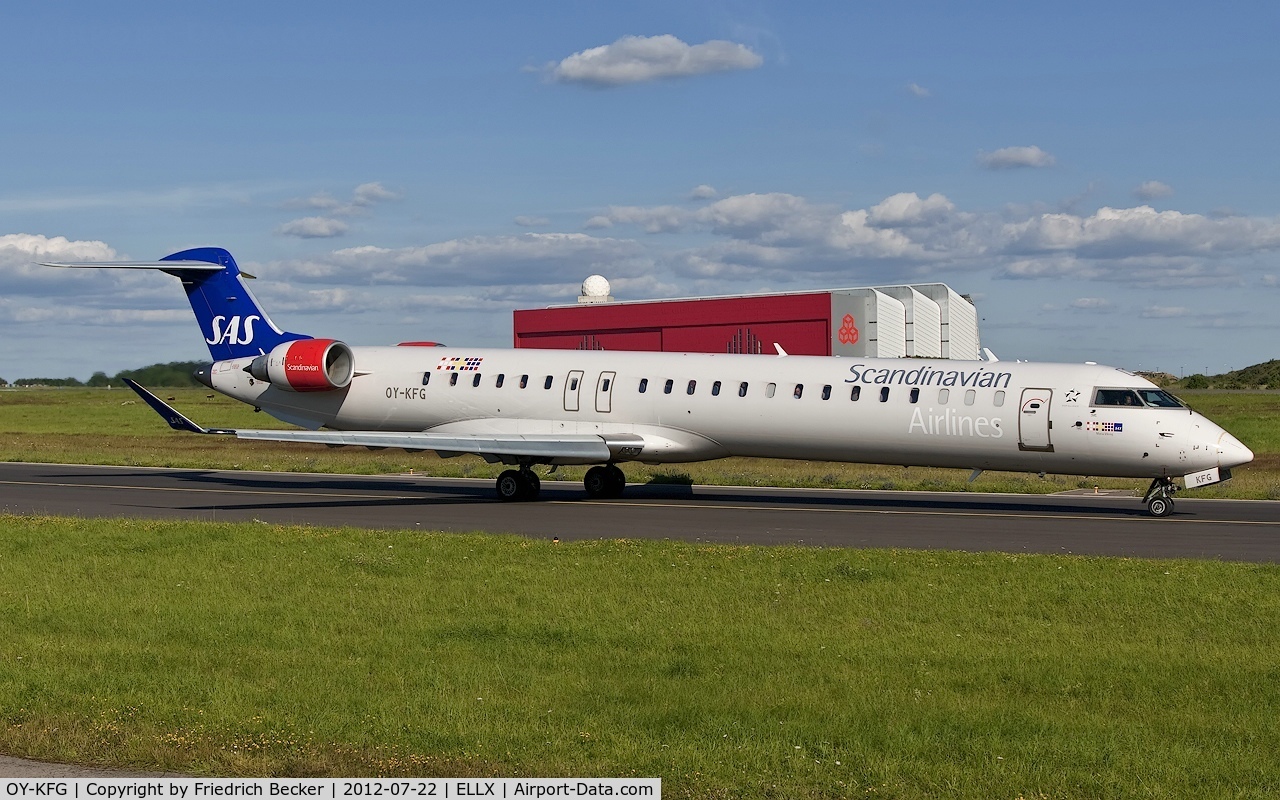 OY-KFG, 2009 Bombardier CRJ-900ER (CL-600-2D24) C/N 15237, taxying to the active