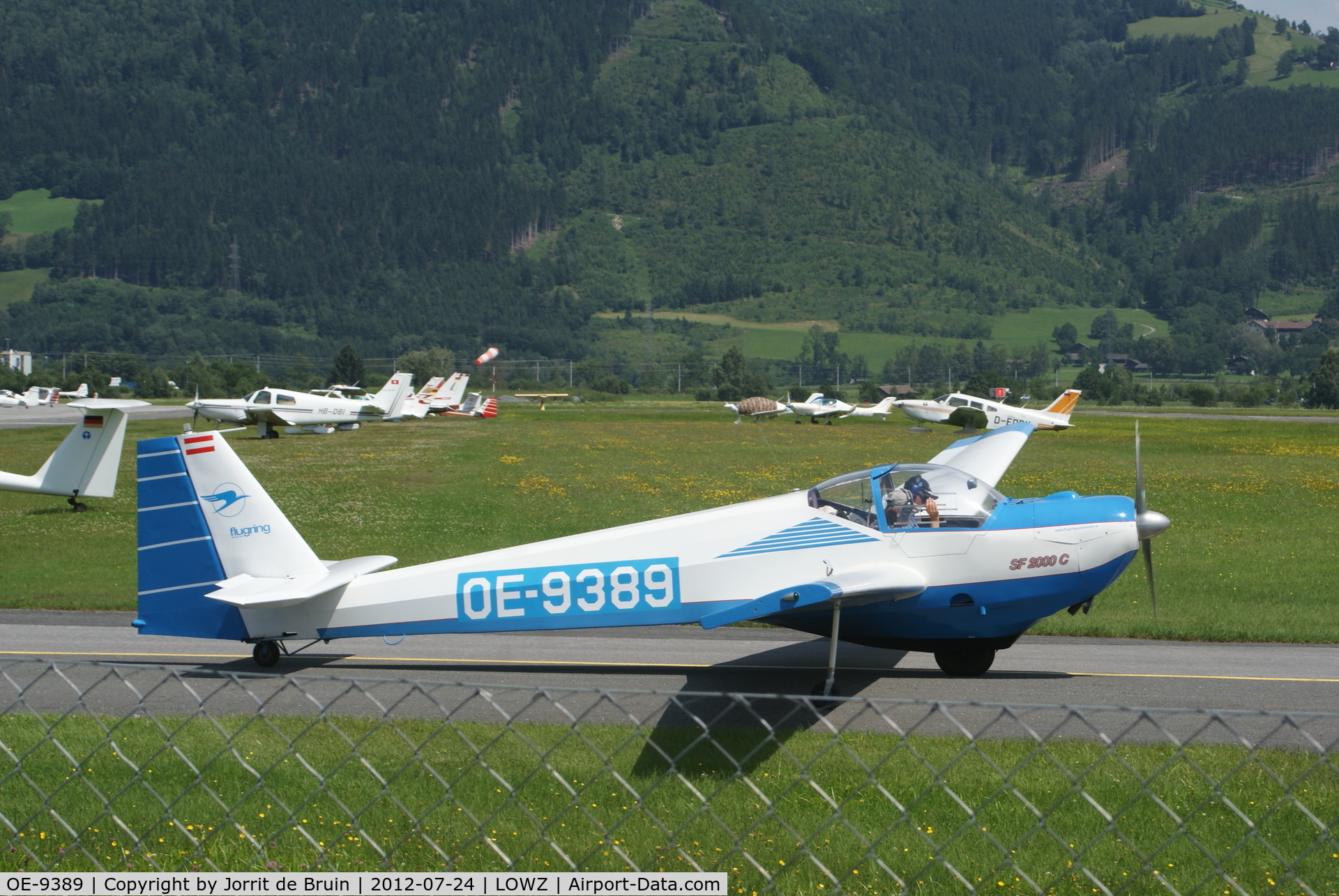 OE-9389, Scheibe SF-25C Falke C/N 44433, The sea-blue motorglider is just doing some motor tests, so he can use the roaring engine to takeoff and climb.