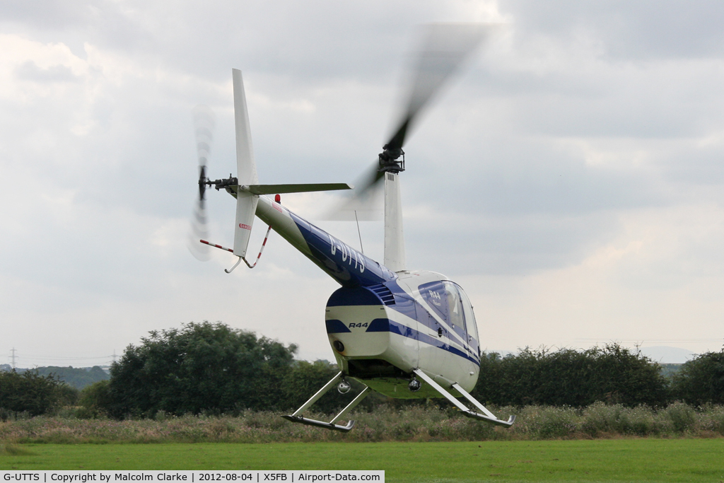 G-UTTS, 2000 Robinson R44 C/N 0865, Robinson R-44, Fishburn Airfield UK, August 2012.