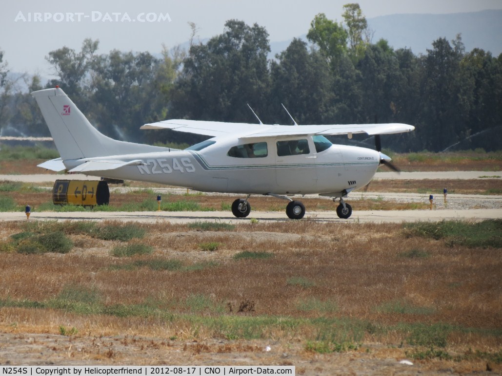 N254S, 1976 Cessna 210L Centurion C/N 21061198, Warming up/preflight on taxiway Papa stopped at taxiway Delta