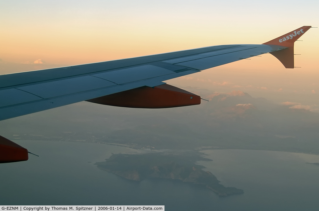 G-EZNM, 2005 Airbus A319-111 C/N 2402, G-EZNM passing Cap Formentor on our flight from DTM ( EDLW ) to PMI ( LEPA ) in the first rays of morning light.