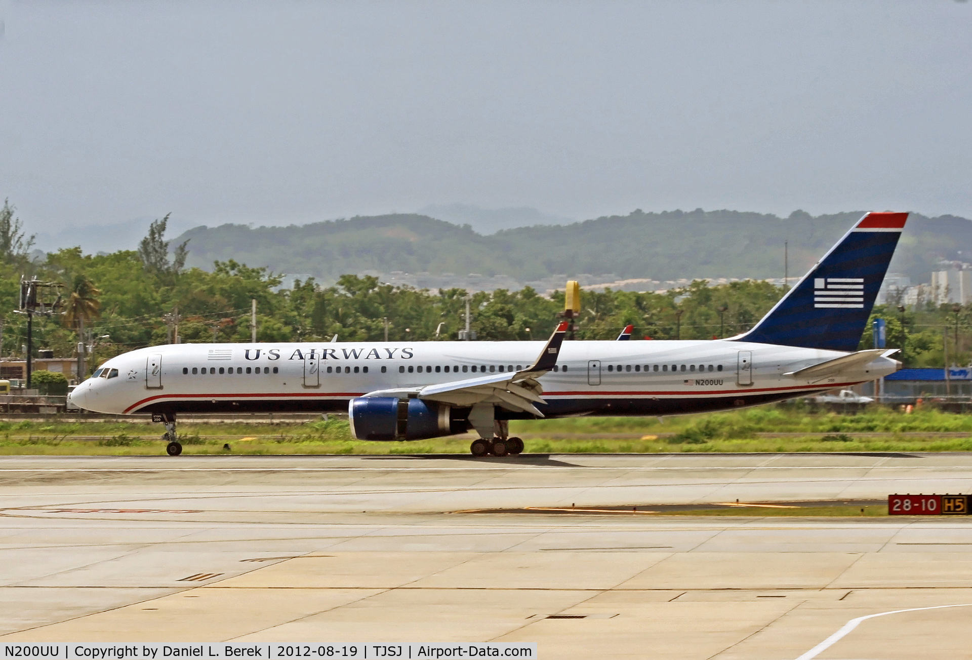 N200UU, 1995 Boeing 757-2B7 C/N 27809, A US Airways Boeing 757, thrust reversers and spoilers deployed, comes to a stop on the southern runway at San Juan.