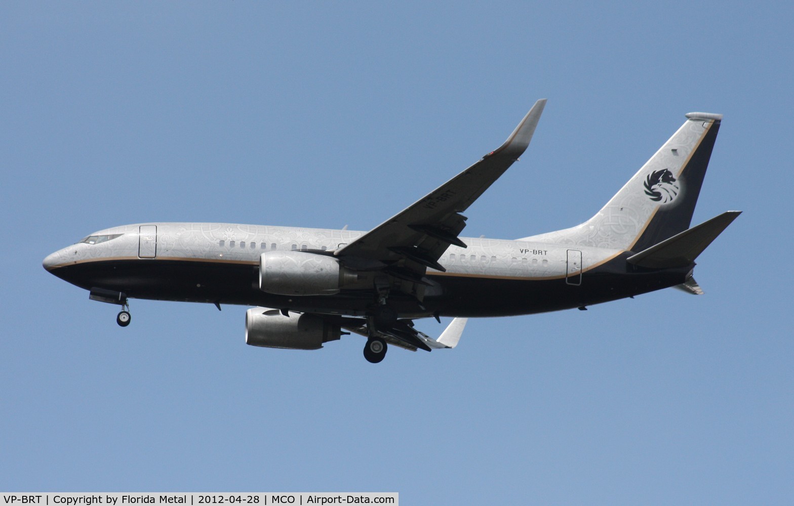 VP-BRT, 2001 Boeing 737-7BC C/N 32970, Very interesting paint job in this BBJ - all kinds of detailed designs in the silver portion of the paint