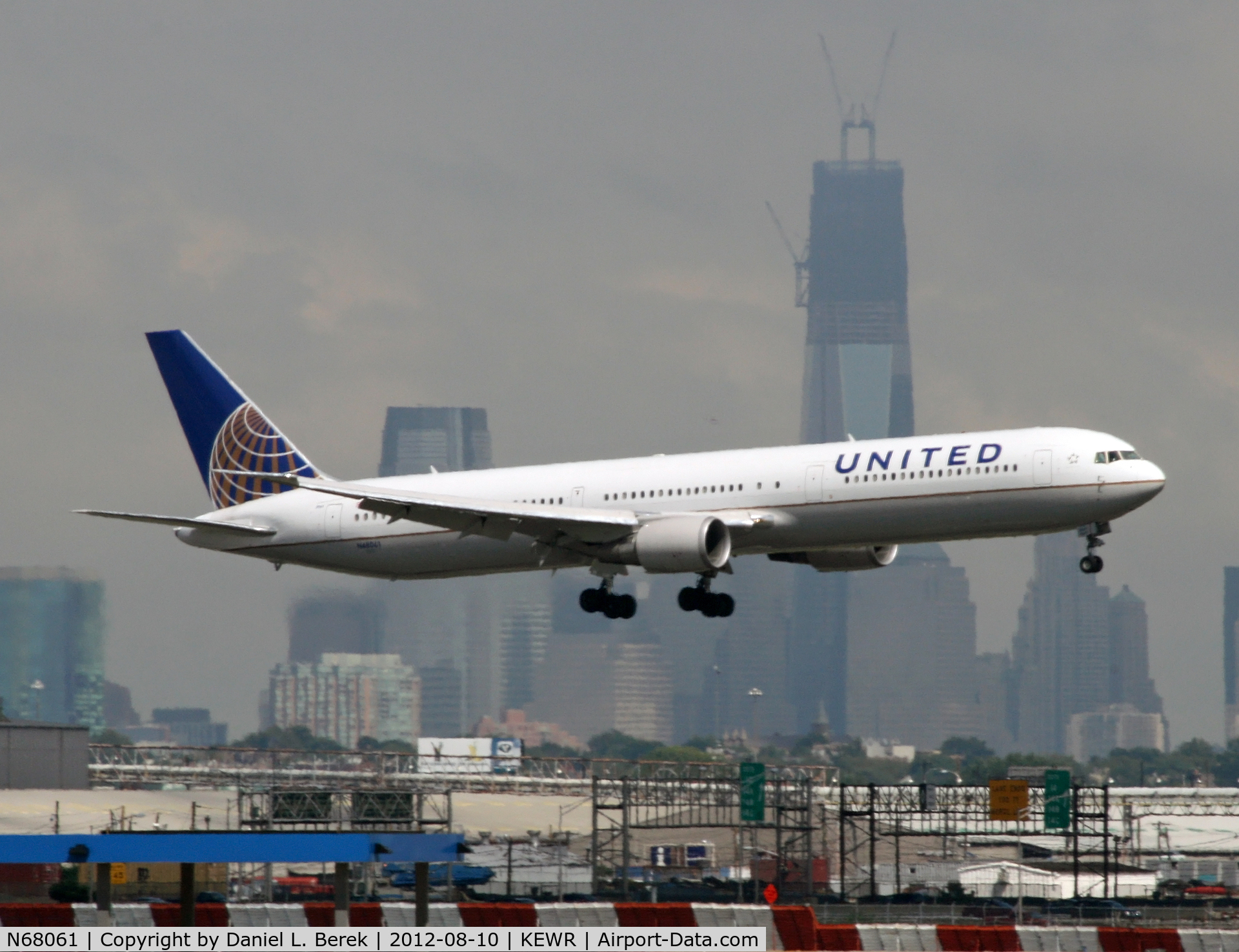 N68061, 2002 Boeing 767-424/ER C/N 29456, With the Liberty Tower in the background, a United Airlines Boeing 767-424/ER comes in for a landing at Newark's short cross-runway.
