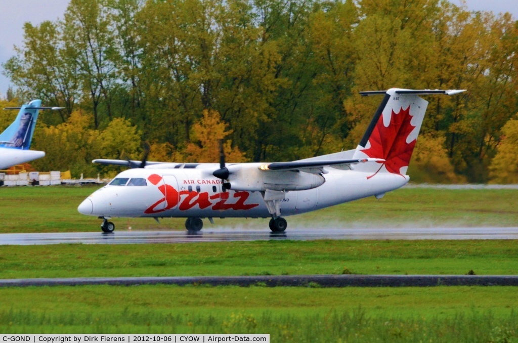C-GOND, 1987 De Havilland Canada DHC-8-102 Dash 8 C/N 090, Starting it's takeoff roll on a wet morning.