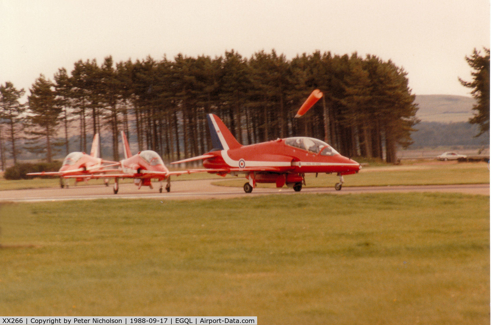 XX266, 1979 Hawker Siddeley Hawk T.1A C/N 102/312102, Hawk T.1A of the Red Arrows aerobatic display team leading a section to the active runway at the 1988 RAF Leuchars Airshow.