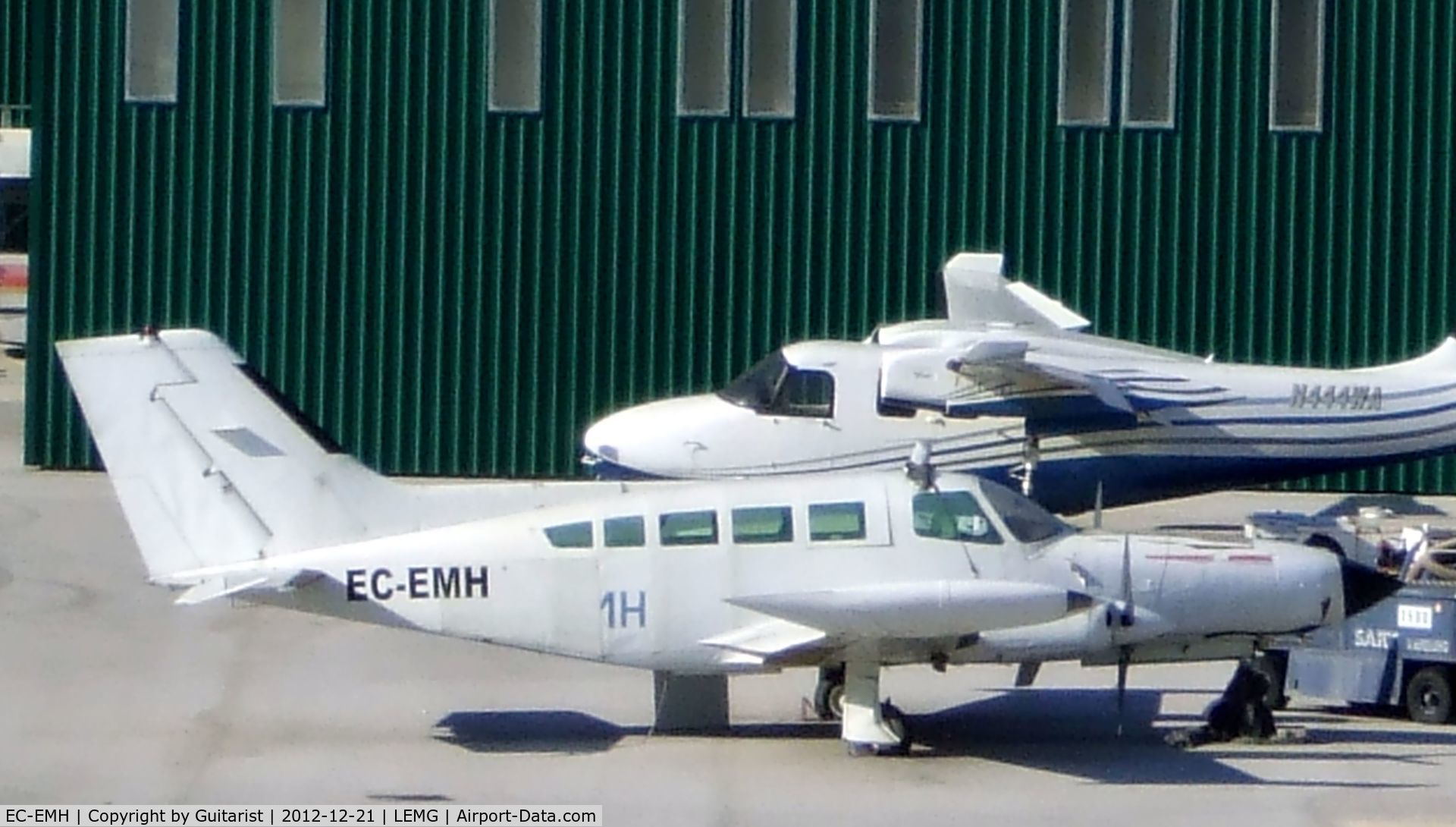 EC-EMH, Cessna 402B C/N 402B-0534, This Cessna looks a bit sorry for itself. N444WA Aero commander is in the background