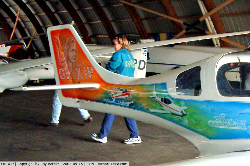 OH-XJP, Lancair 320 C/N 169, Lancair 320 [169] Piikajarvi~OH 15/05/2003. Showing the rear art work on this side of the aircraft.