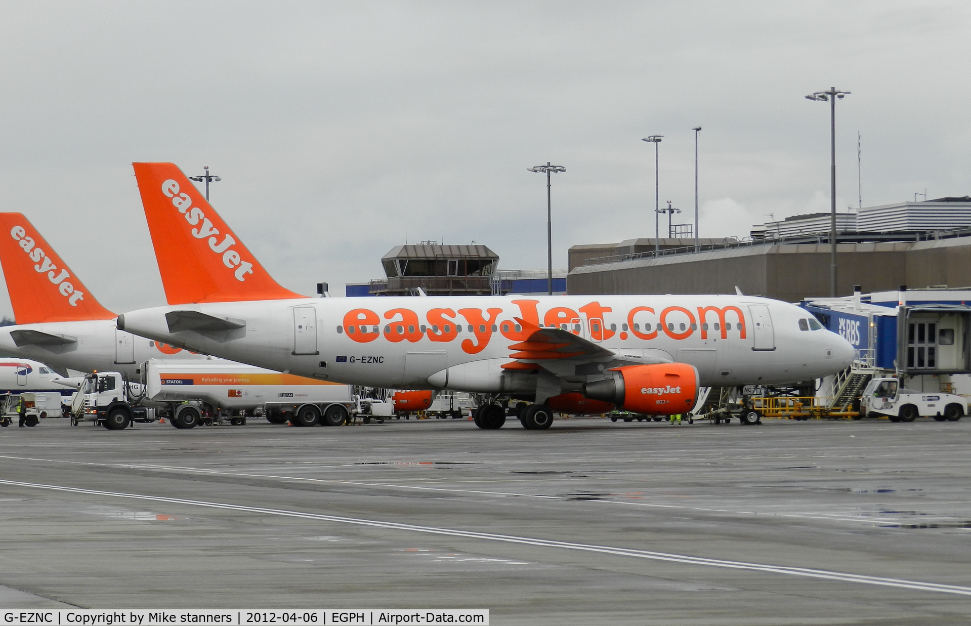G-EZNC, 2003 Airbus A319-111 C/N 2050, Easyjet A319 on the international arrivals terminal having just arrived from Madrid