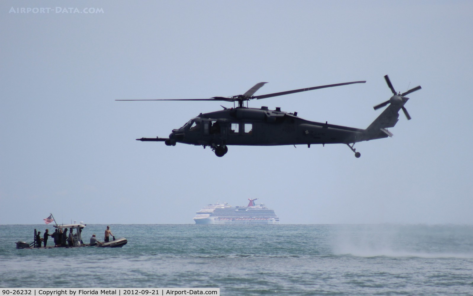 90-26232, 1990 Sikorsky HH-60L Black Hawk C/N 701599, HH-60L demo over Cocoa Beach, Carnival Cruise Lines arriving to Port Canaveral in background