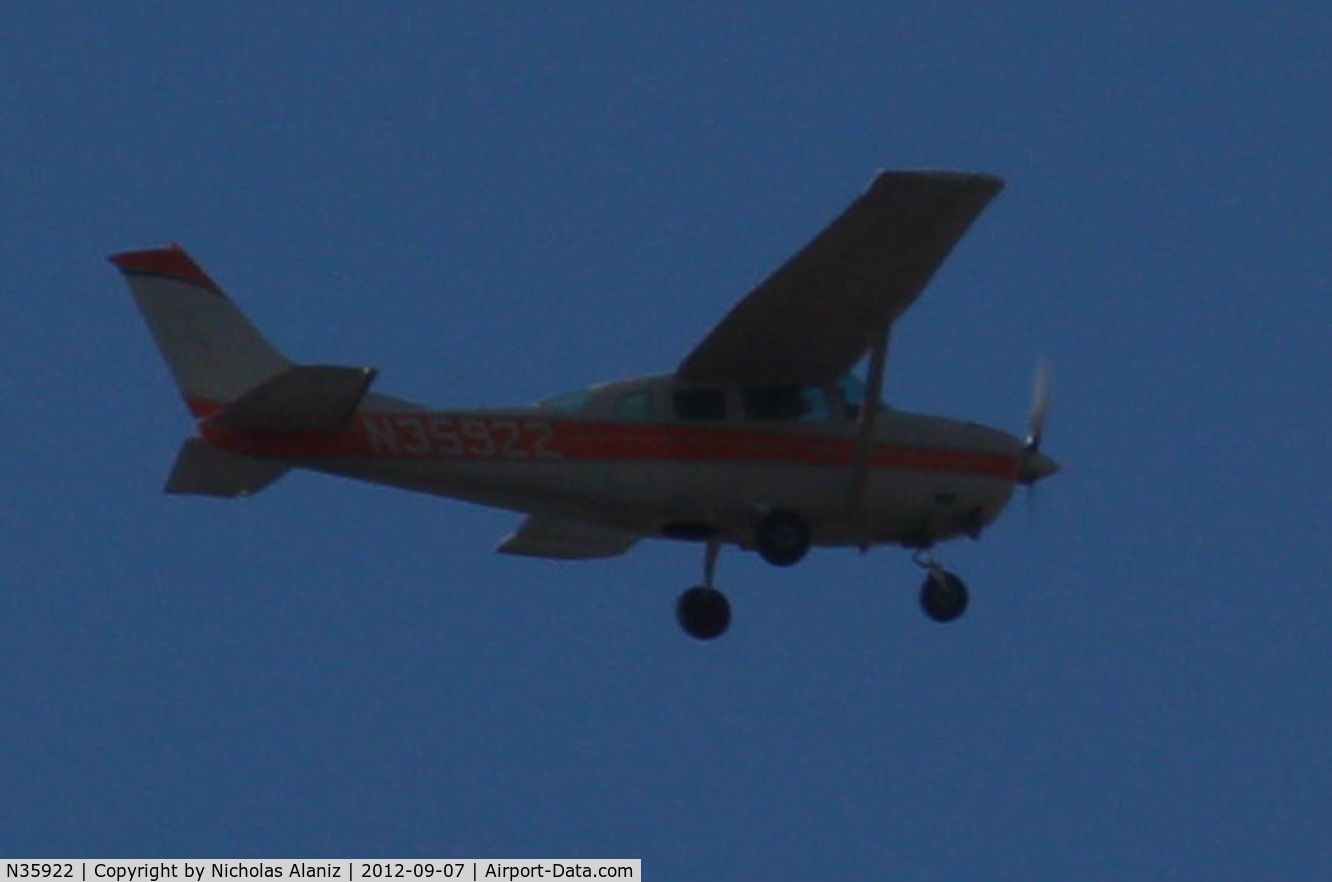 N35922, 1975 Cessna TU206F Turbo Stationair C/N U20602801, Flying over Ontario California, 4:25 p.m. September 7, 2012.