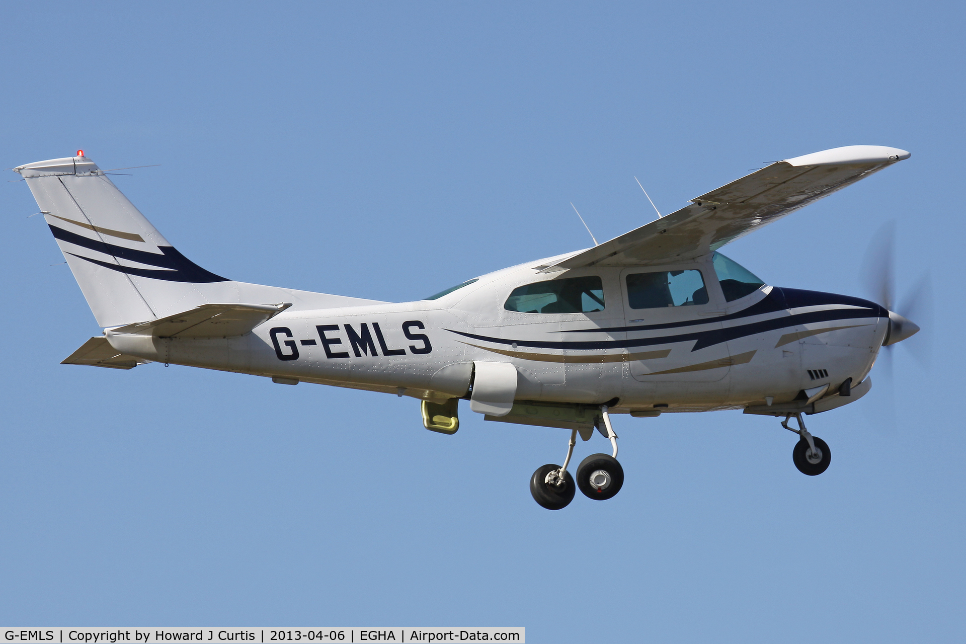 G-EMLS, 1974 Cessna T210L Turbo Centurion C/N 210-60094, Privately owned. Caught on departure; always fascinating to watch the gear go up on these Cessnas.