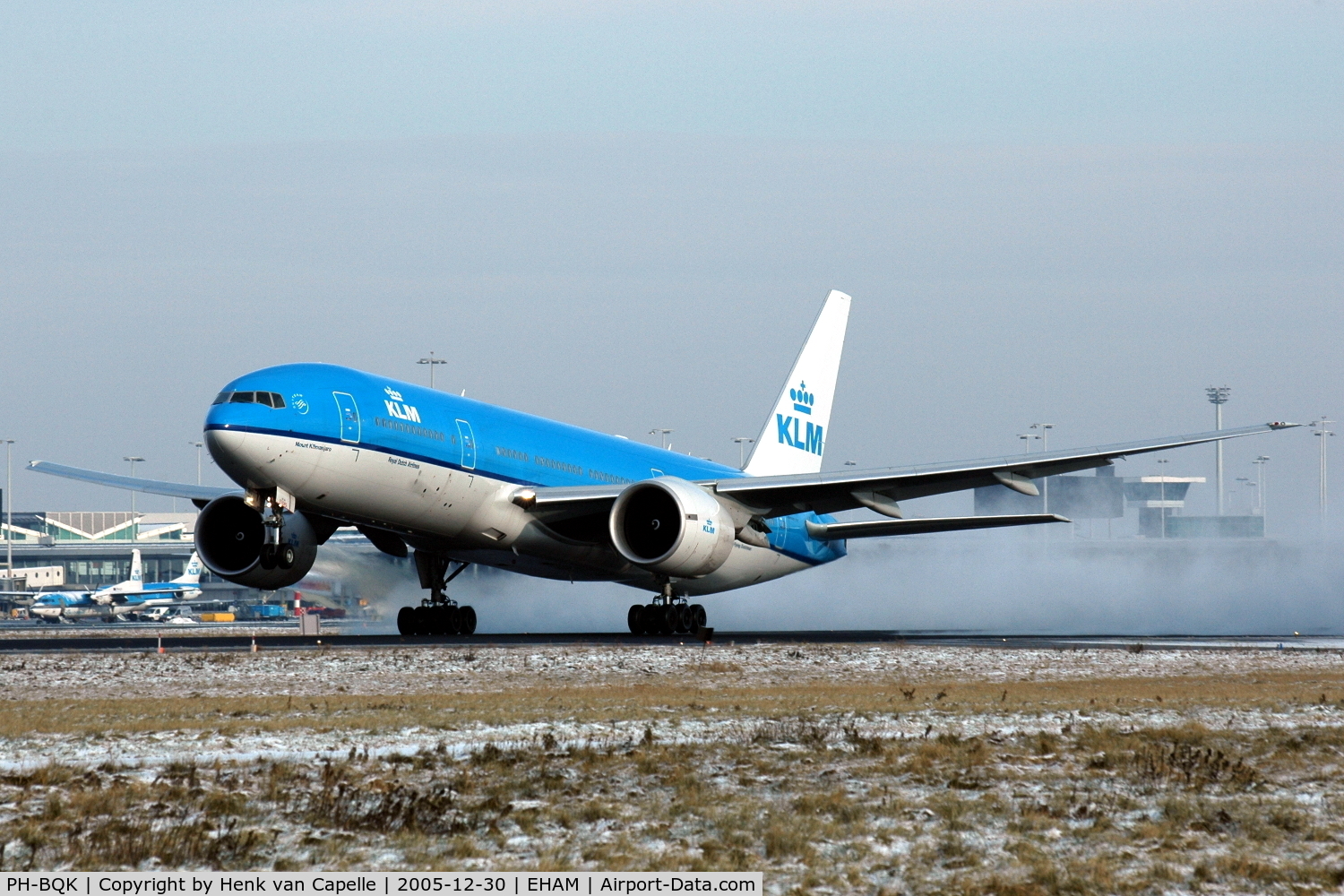 PH-BQK, 2005 Boeing 777-206/ER C/N 29399, KLM Boeing 777-200 kicking up snow while rotating for take off from Amsterdam Schiphol airport.