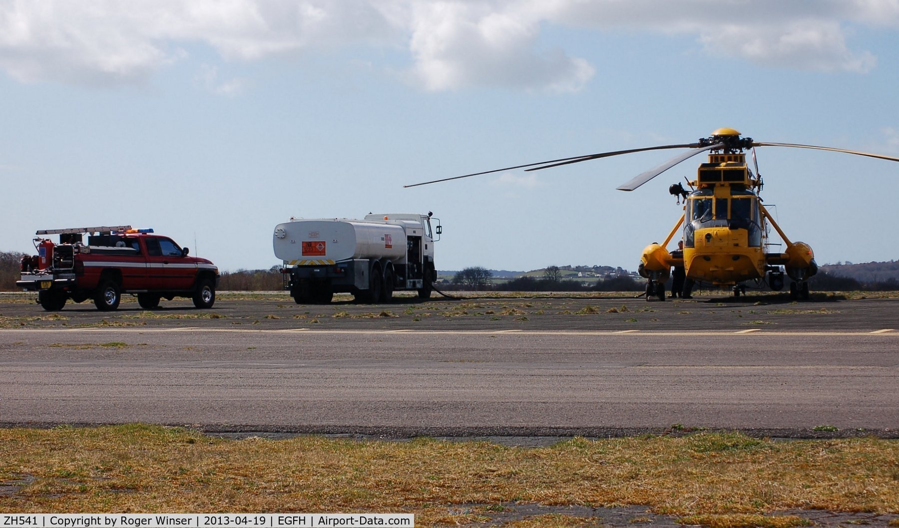 ZH541, Westland Sea King HAR.3A C/N WA1007, Visiting Sea King helicopter from 22 Squadron RAF taking on fuel with Swansea Airport's fire and rescue tender FIRE 2 in attendance.