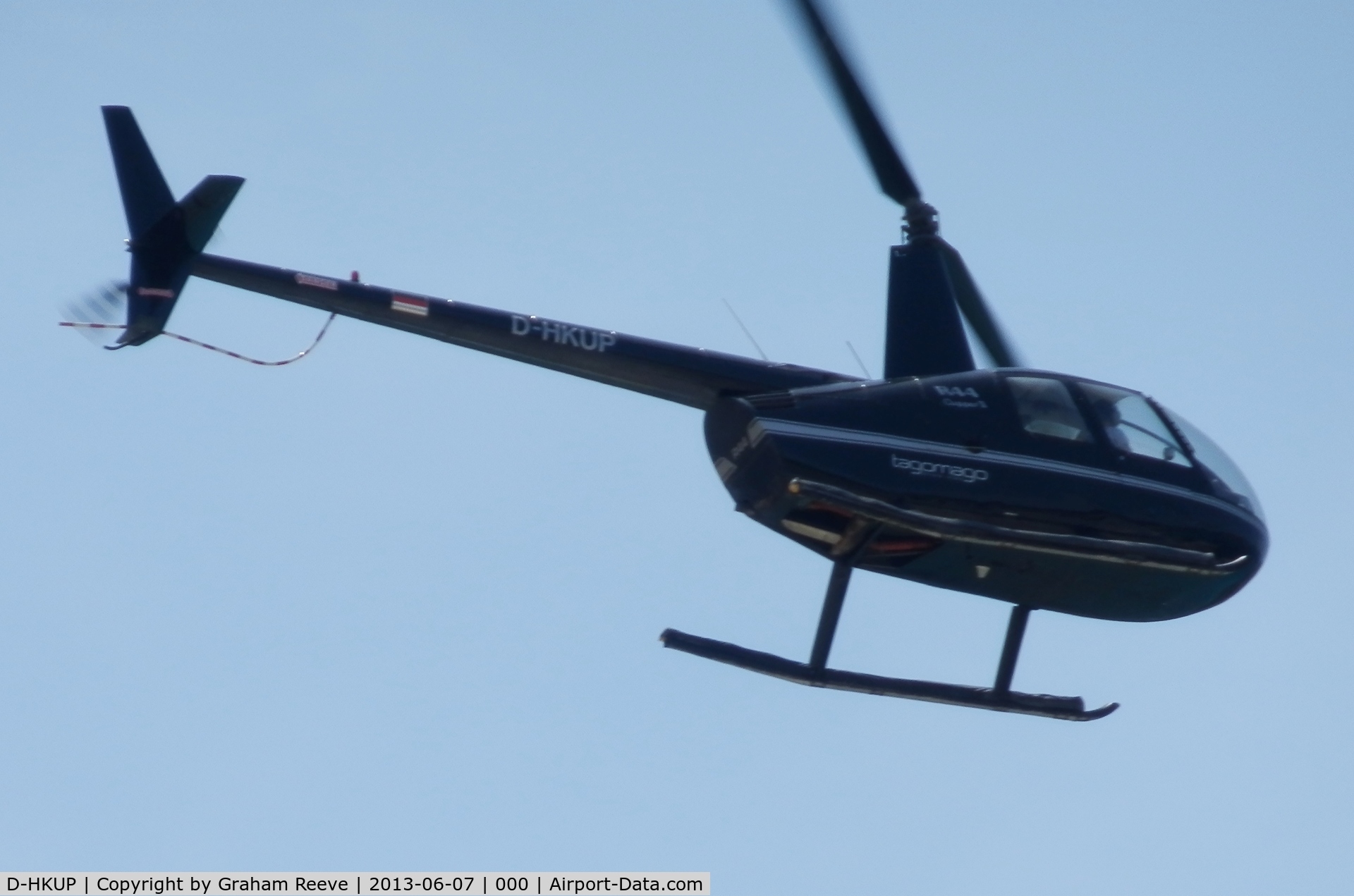 D-HKUP, Robinson R44 C/N 11450, Photograpged at a distance having just taken off at Camp de Mar, Majorca.