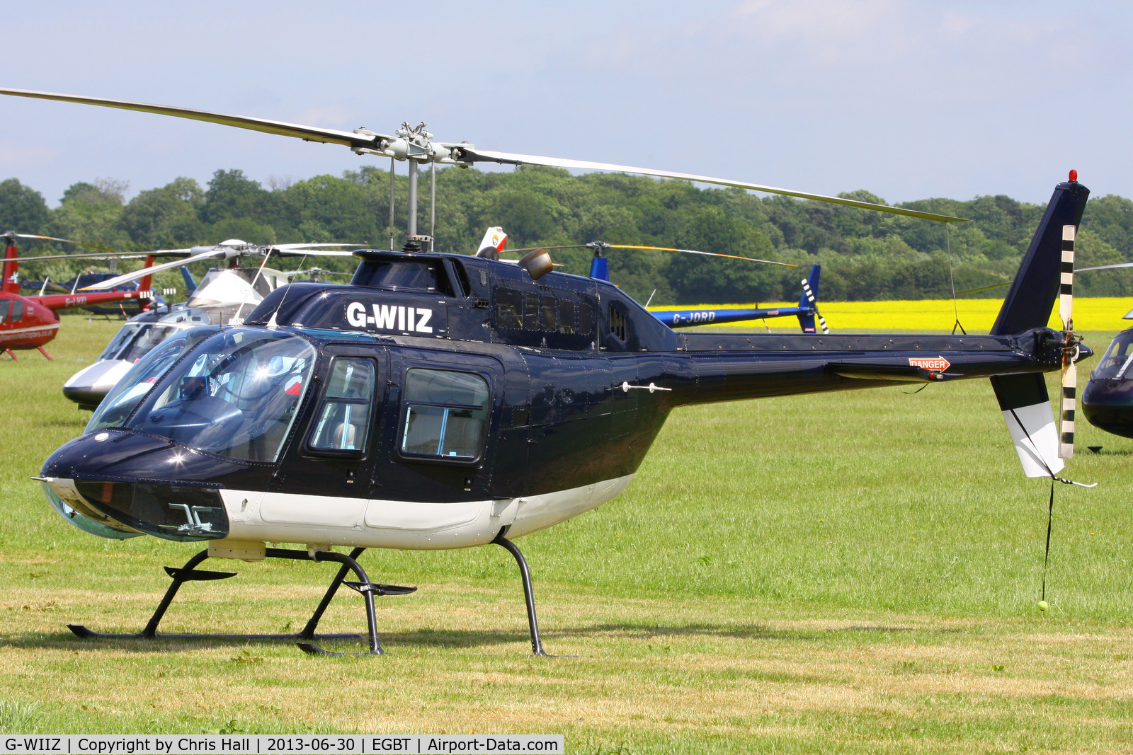 G-WIIZ, 1969 Agusta AB-206B JetRanger II C/N 8111, being used for ferrying race fans to the British F1 Grand Prix at Silverstone