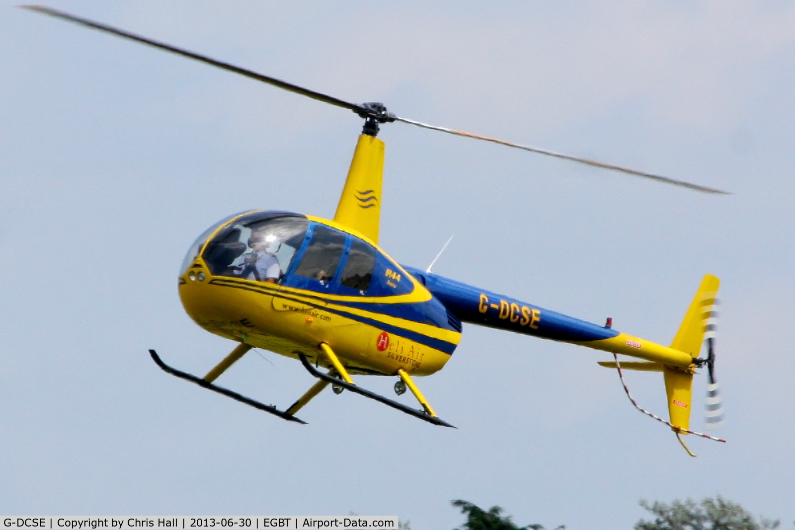 G-DCSE, 1999 Robinson R44 Astro C/N 0659, being used for ferrying race fans to the British F1 Grand Prix at Silverstone