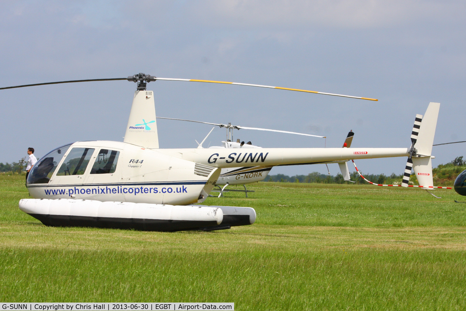 G-SUNN, 2004 Robinson R44 Clipper C/N 1367, being used for ferrying race fans to the British F1 Grand Prix at Silverstone