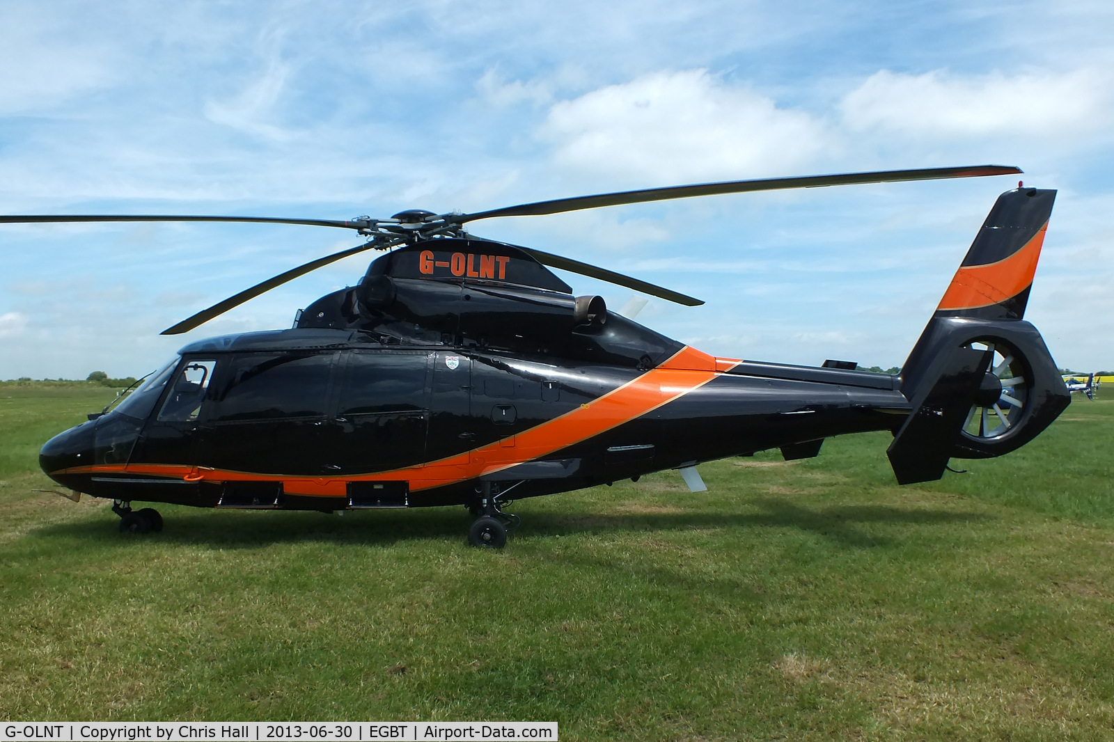 G-OLNT, 1988 Aérospatiale SA-365N-1 Dauphin 2 C/N 6309, being used for ferrying race fans to the British F1 Grand Prix at Silverstone