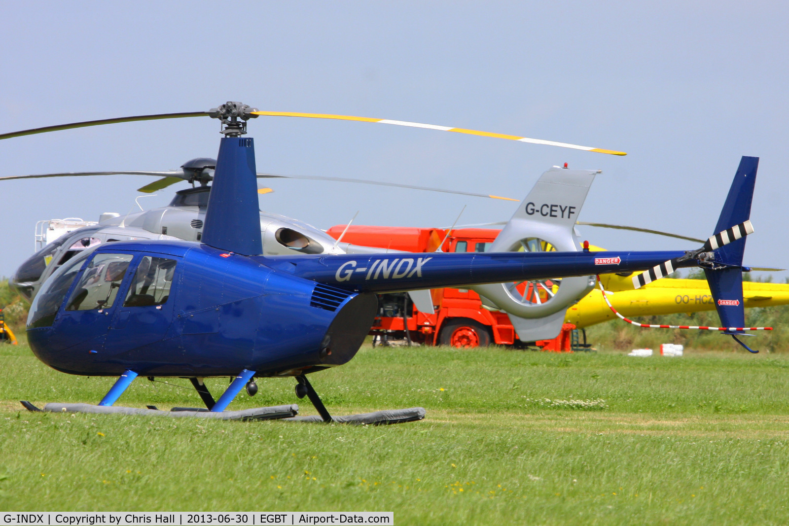 G-INDX, 2004 Robinson R44 Clipper II C/N 10491, being used for ferrying race fans to the British F1 Grand Prix at Silverstone