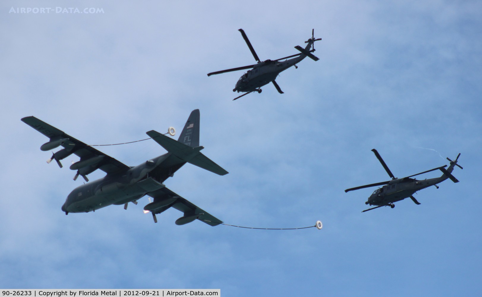 90-26233, Sikorsky HH-60L Black Hawk C/N 701600, HH-60L flying with partner and C-130 over Cocoa Beach