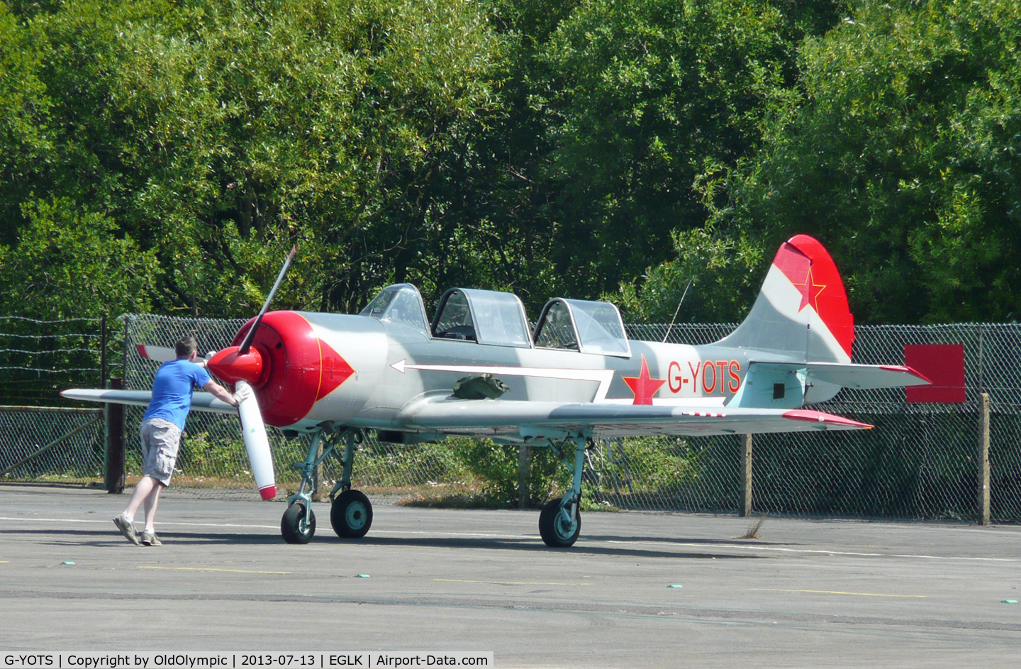 G-YOTS, 1990 Bacau Yak-52 C/N 9010308, Pushing to parking on arrival!