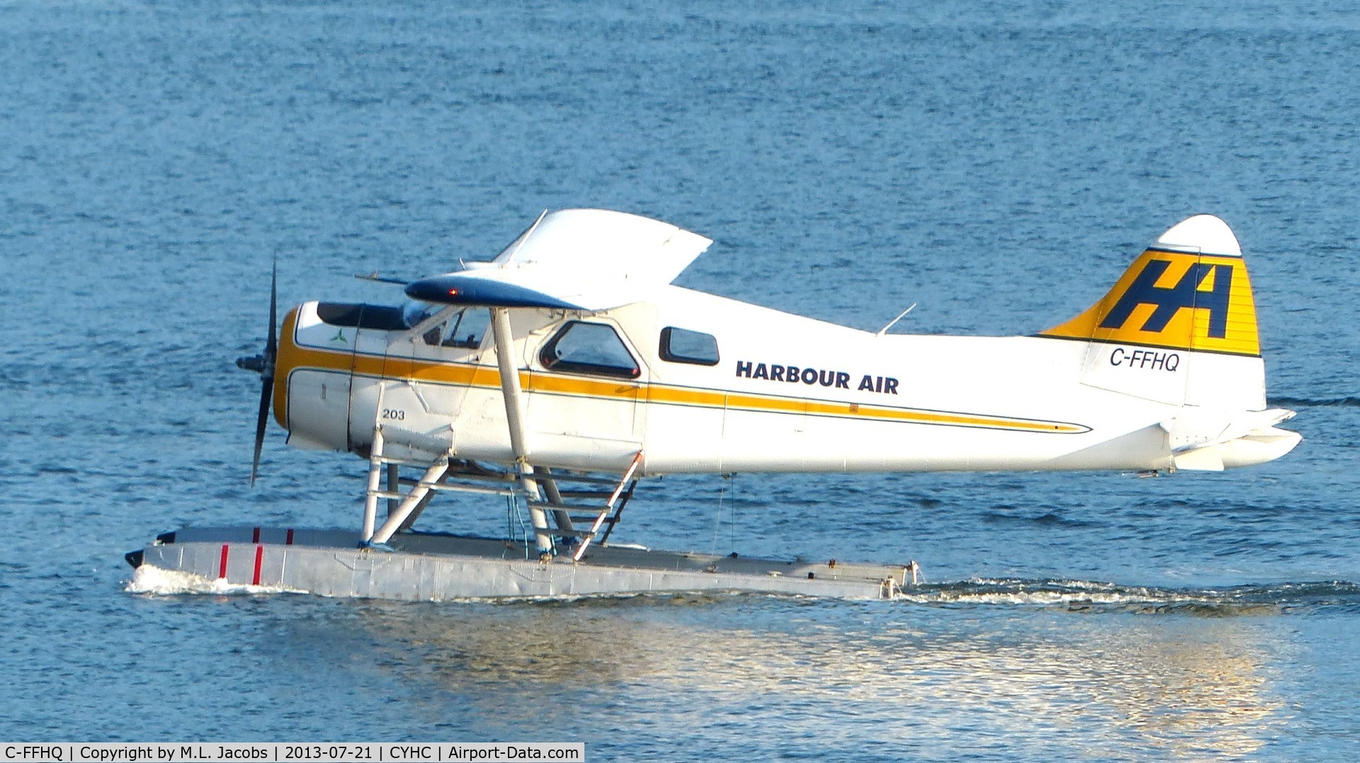 C-FFHQ, 1949 De Havilland Canada DHC-2 Beaver Mk.1 C/N 42, Harbour Air #203 taxiing to takeoff position in Coal Harbour.