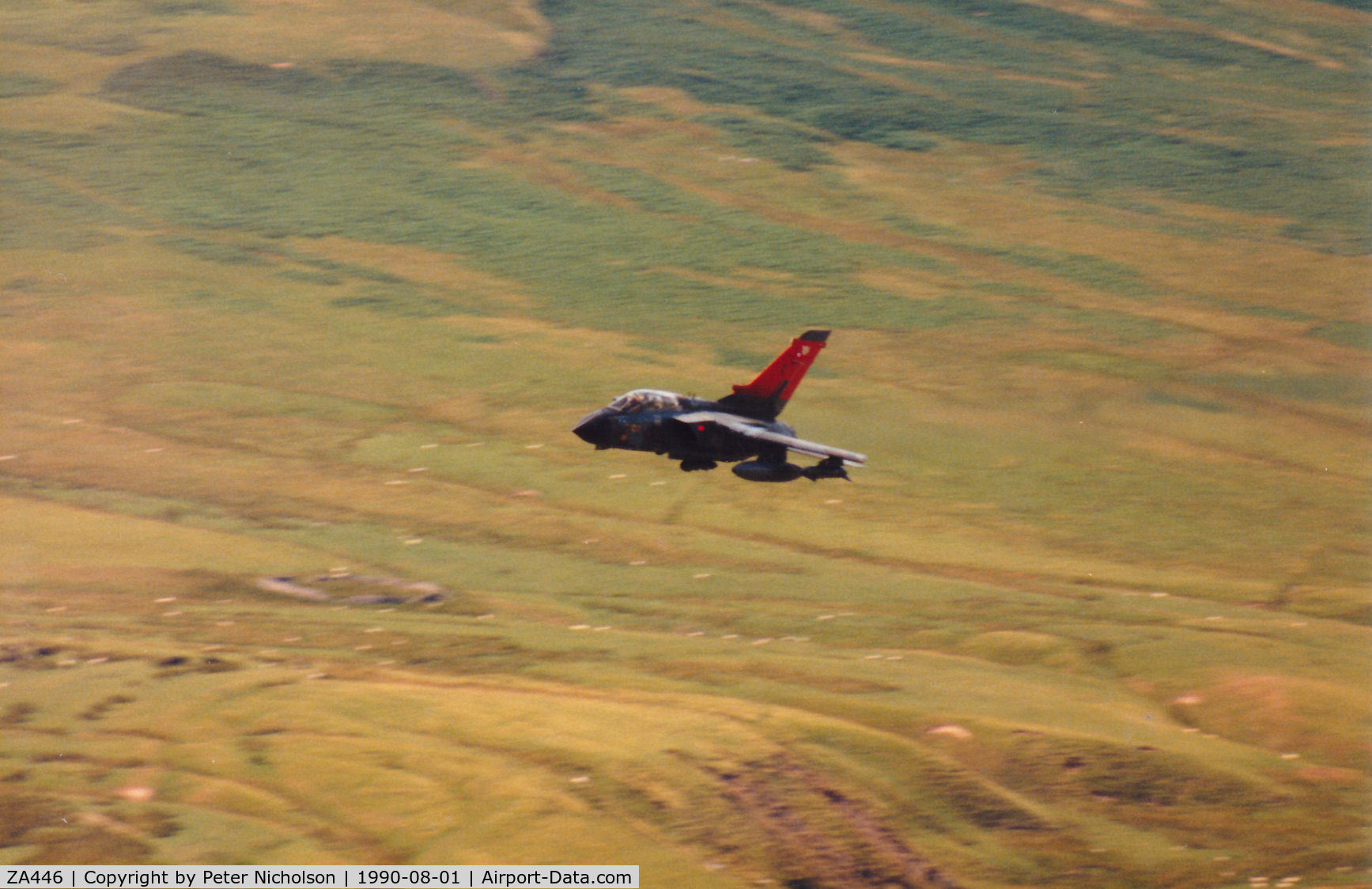 ZA446, 1983 Panavia Tornado GR.1 C/N 234/BS076/3112, Tornado GR.1 of 15 Squadron then based at RAF Bruggen, with high-conspicuity tail markings, departing Otterburn Range on a Mallet Blow mission in August 1990.