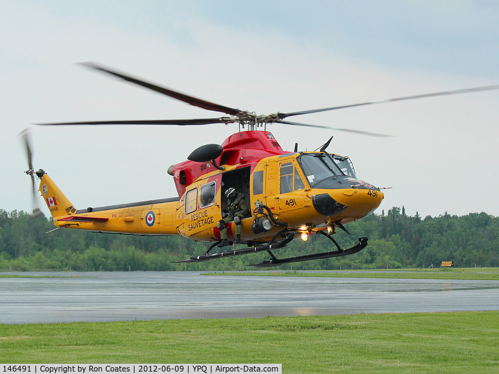 146491, Bell CH-146 Griffon C/N 46491, This 1997 Bell Griffon RCAF Rescue helicopter lands in Peterborough, Ontario for fuel.