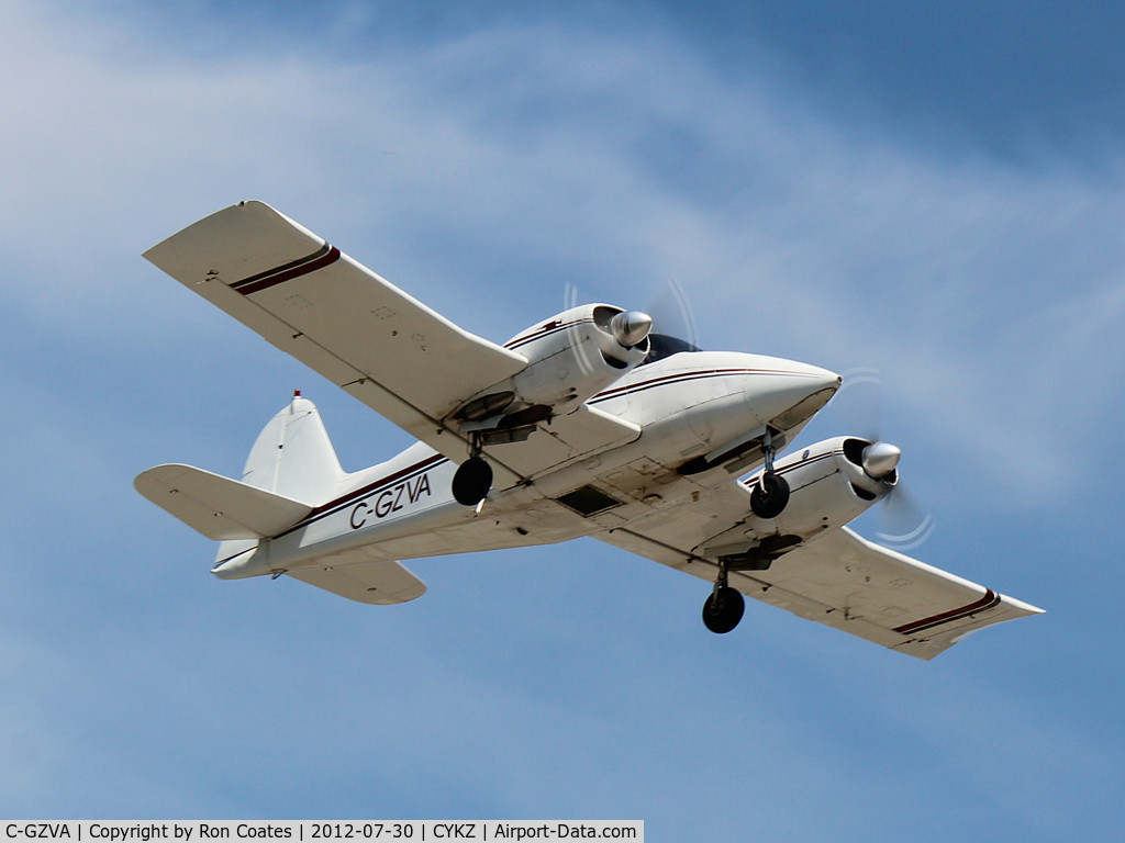 C-GZVA, 1956 Piper PA-23-250 Aztec C/N 23-466, Lifting off runway 15 this 1956 Piper 23A is doing touch and go's at Buttonville Airport (YKZ)