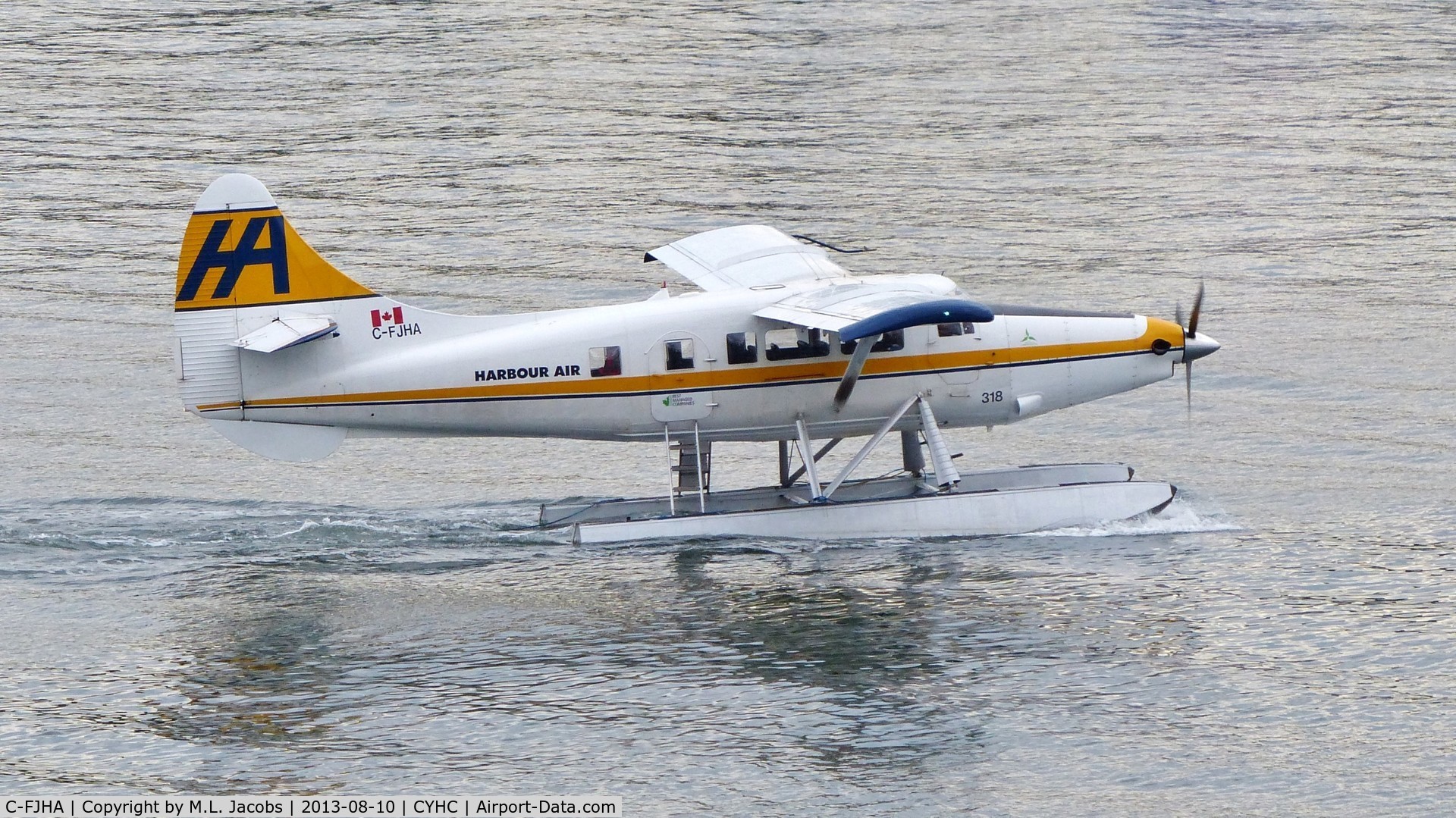 C-FJHA, 1960 De Havilland Canada DHC-3 Turbo Otter Otter C/N 393, Harbour Air #318 taxiing for departure from Coal Harbour.