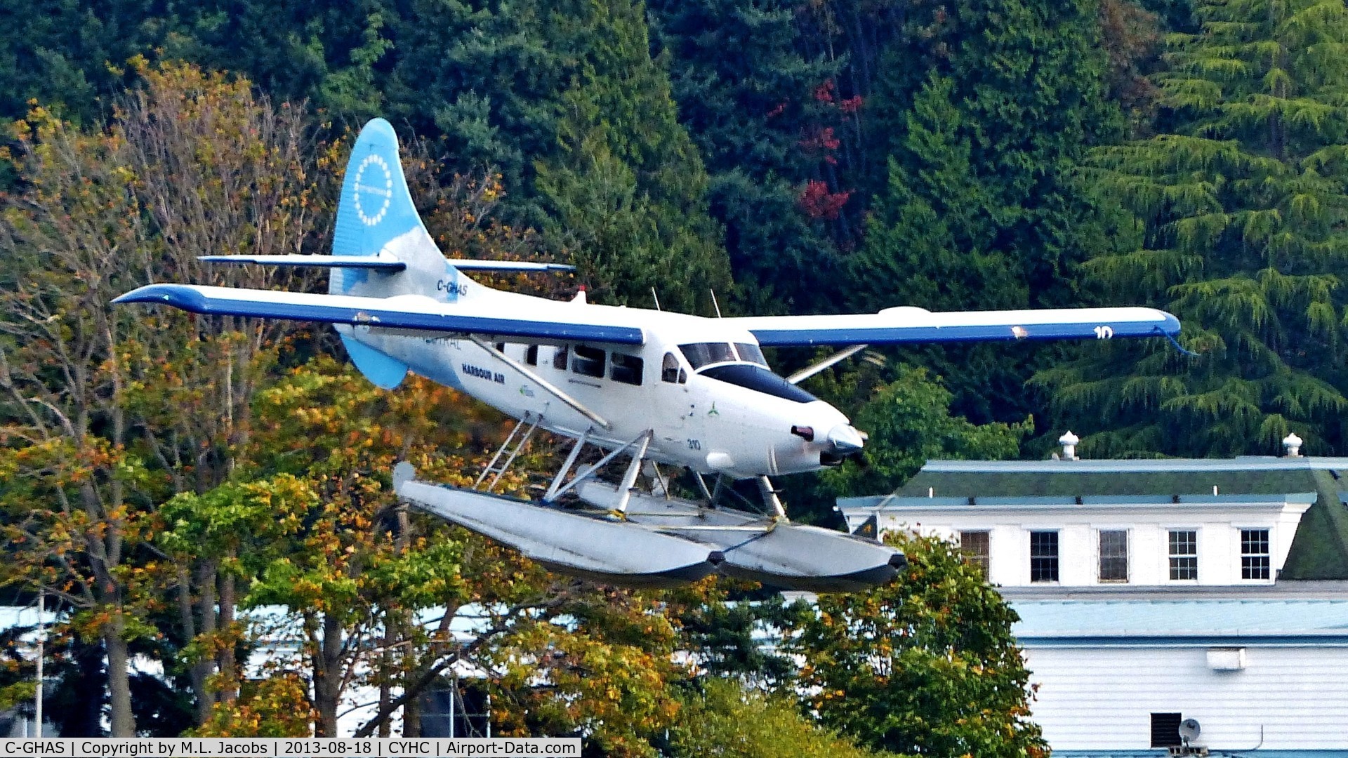 C-GHAS, 1958 De Havilland Canada DHC-3 Otter C/N 284, Harbour Air #310 approaching over Stanley Park to land in Coal Harbour.