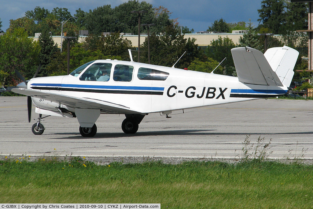 C-GJBX, 1957 Beech J35 Bonanza C/N D-5360, Lined up & ready to roll on runway 33 was this nice Bonanza with its neat looking Butterfly Tail. It was built in 1958 & lives in Toronto. I think people who are not even interested in aircraft still reconize this type.