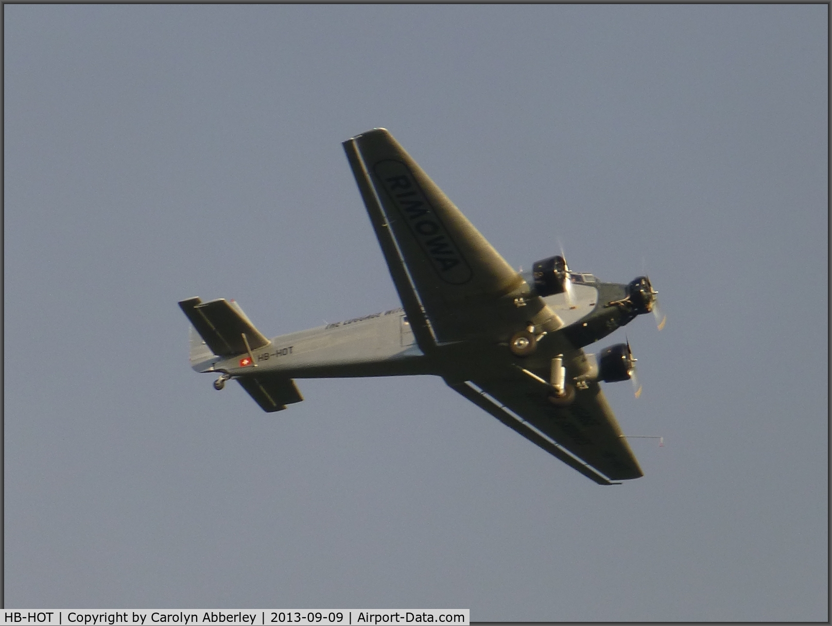 HB-HOT, 1939 Junkers Ju-52/3m g4e C/N 6595, In flight above Maidenhead, UK at c.18:30 9 September 2013.