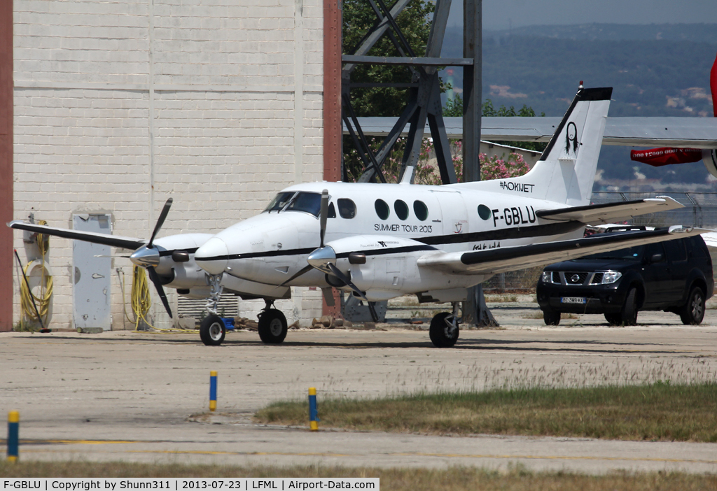 F-GBLU, 1979 Beech C90 King Air C/N LJ-822, Parked at Boussiron area with additional 'AOKIJET / Summer Tour 2013' titles