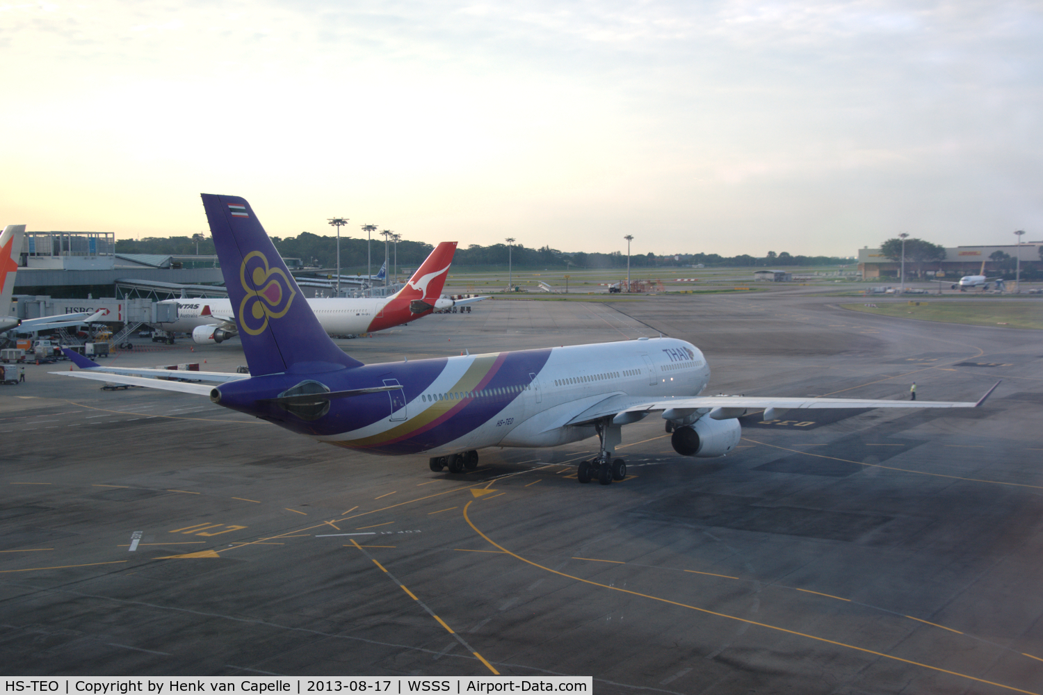 HS-TEO, 2009 Airbus A330-343 C/N 1003, Thai Airbus A330-300 taxying away from the terminal at Singapore Changi airport.