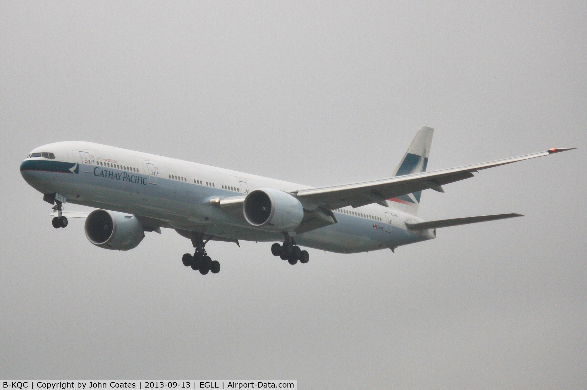 B-KQC, 2012 Boeing 777-367/ER C/N 39236, Finals to 27L in heavy drizzle.