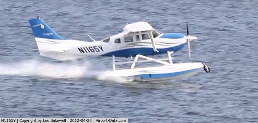 N1165Y, 2006 Cessna T206H Turbo Stationair C/N T20608686, Amphibious float plane (seaplane) taking off from Forest Lake #2.  There is actually a short video of this takeoff on Youtube.  Just search for N1165Y.
