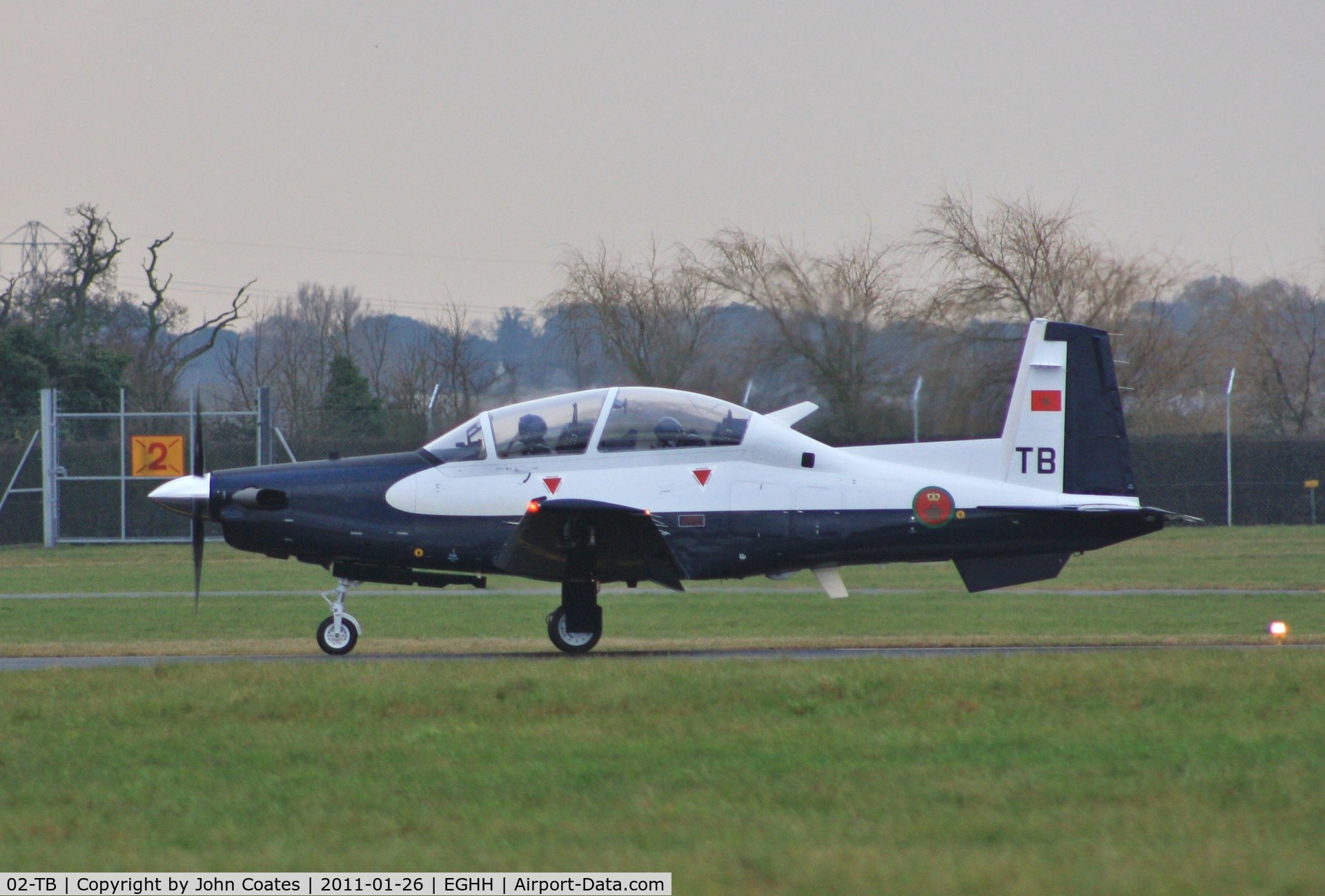 02-TB, 2010 Raytheon T-6C Texan II C/N PM-2, Departing on delivery