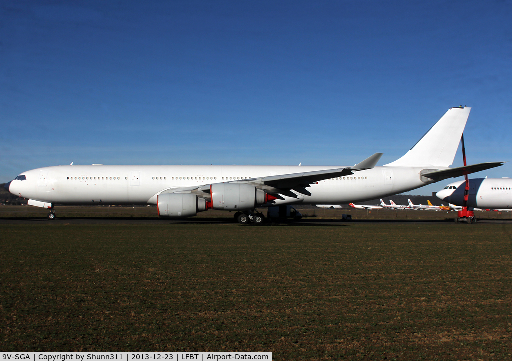9V-SGA, 2003 Airbus A340-541 C/N 492, Stored in all white c/s without titles, grey engines and registration partially visible
