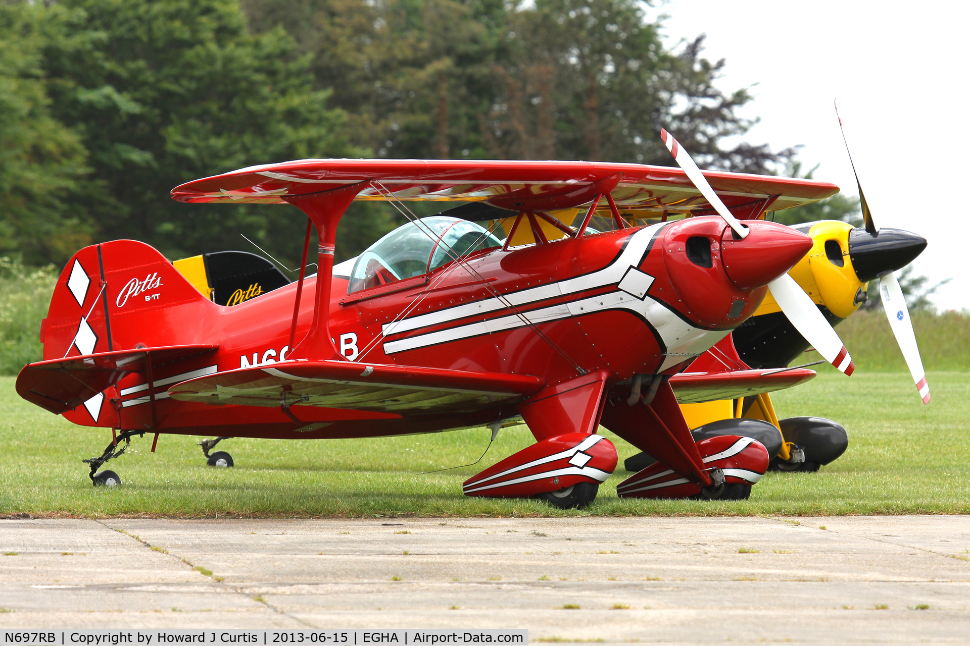 N697RB, 1986 Pitts S-1T Special C/N 1042, Privately owned, at the aerobatic competition here. With Pitts G-MAXG behind.